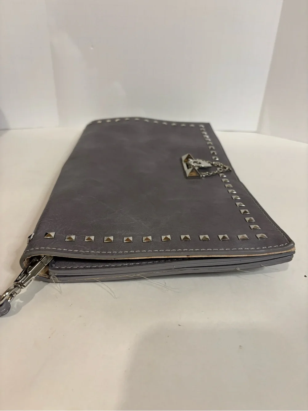 Stud-Trim Gray Wristlet Clutch